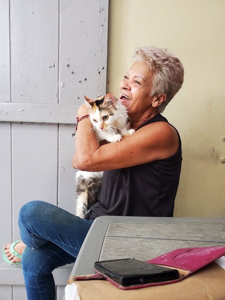 Gloria Marti holding a rescued cat at the shelter