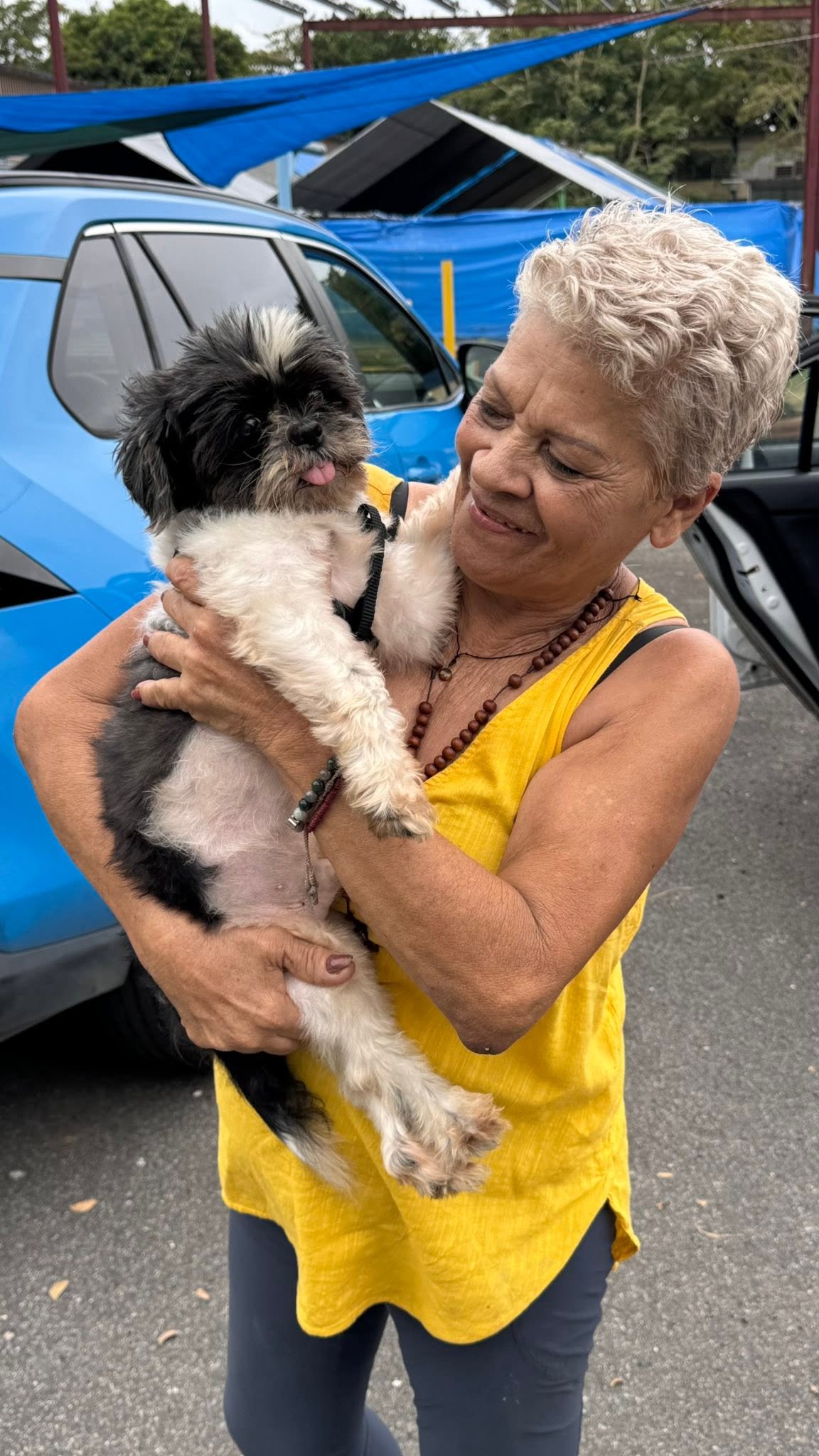 Gloria Marti holding a rescued dog