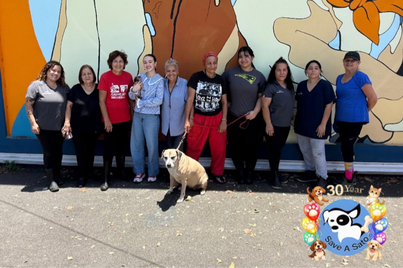 The shelter team together on the 30th anniversary